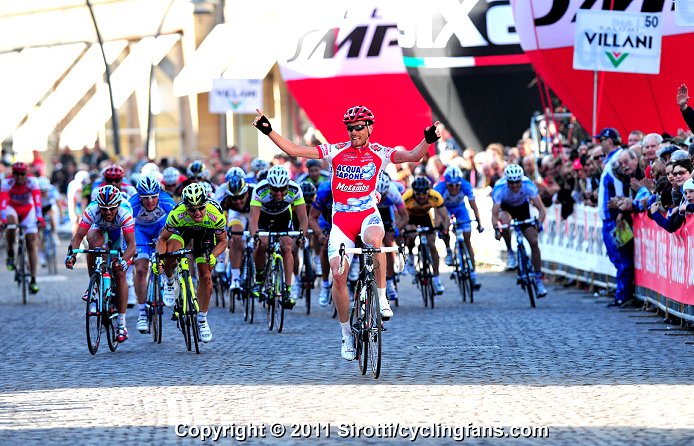 Claudio Corioni (Acqua & Sapone) attacked in the final kilometer, then held off the charging peloton for a victory in Stage 2.