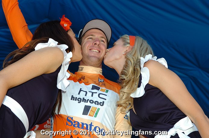 Stage 1 winner and race leader Matt Goss gets kisses from the podium girls.
